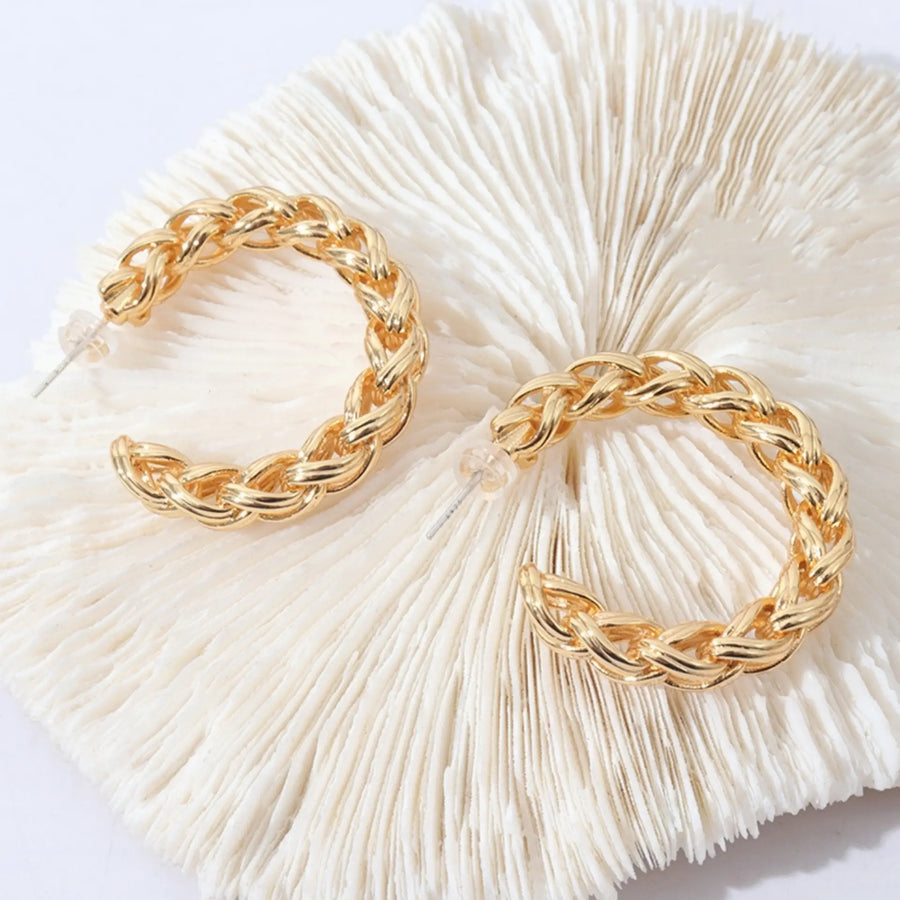 C-shaped twist gold earrings