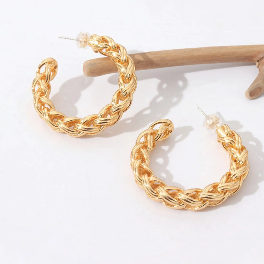 C-shaped twist gold earrings