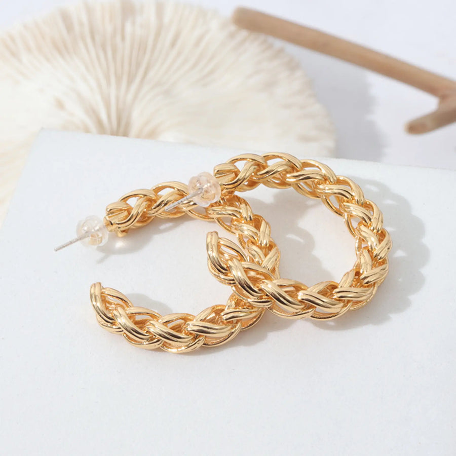 C-shaped twist gold earrings