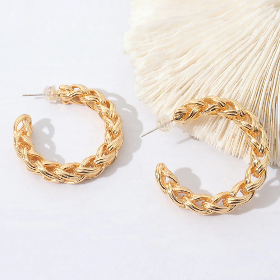 C-shaped twist gold earrings